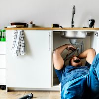 plumber-man-fixing-kitchen-sink